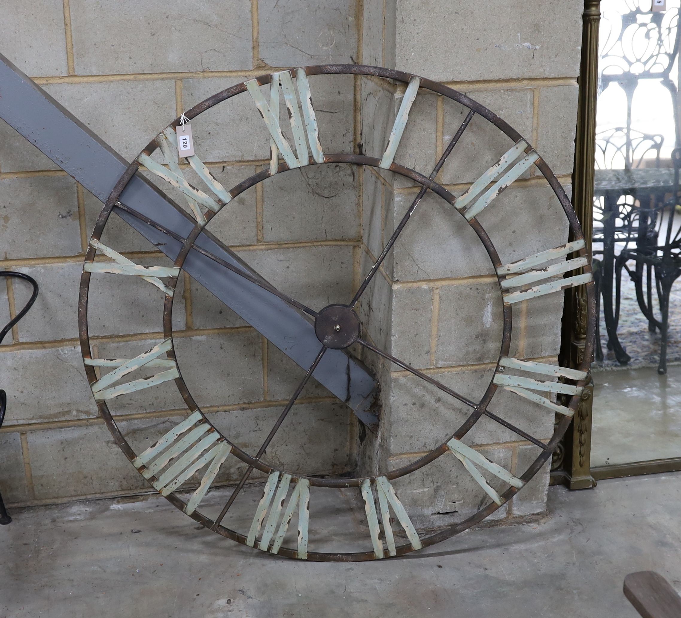 A decorative metal clock dial, diameter 122cm